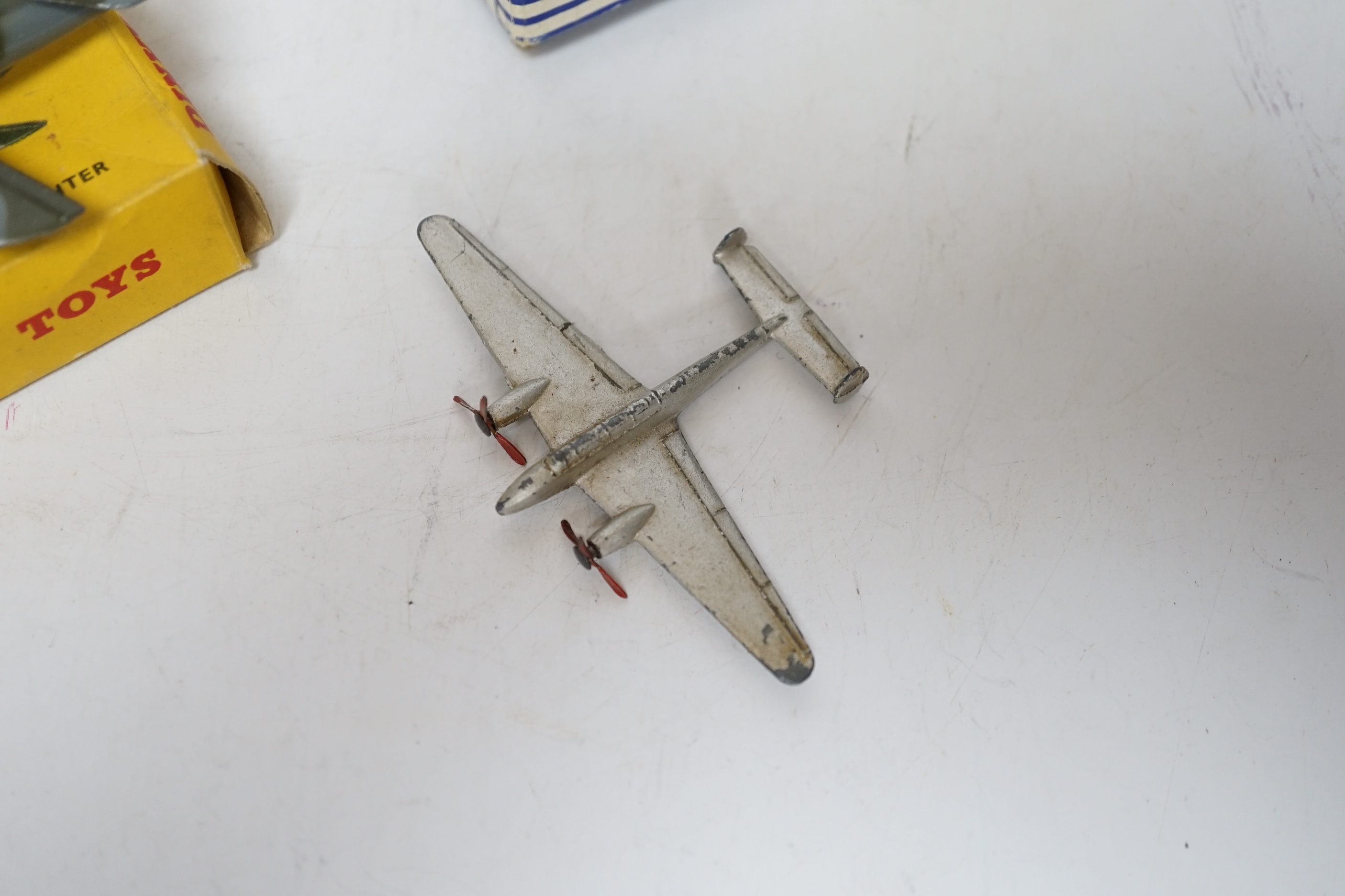 Four Dinky Toys aircraft; three boxed examples including (702) DH Comet Airliner, (70A) Avro York Airliner, (736) Hawker Hunter Fighter, and an unboxed Twin Engined Fighter